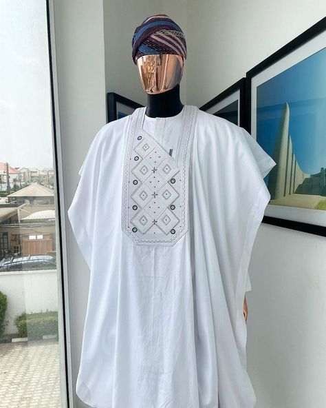 A white,square dropping-layered embroidery design details agbada, buba & sokoto  what you get:  agbada kaftan men’s top pant trousers  price - available on website  to order:  imessage, text or whatsapp : +2348179435662 +2239179435663 email: info@dejiandkola.com website: dejiandkola.com White Agbada Designs For Men, White Agbada Styles Men, White Agbada Designs, Latest Agbada Designs, Agbada Styles Men, Agbada Designs For Men, White Agbada, Agbada Outfit, Agbada Design