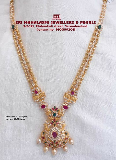 Light weight 40grams 3lines Balls Long Harram with Peacock Locket. Please visit our showroom for full tange of collection at WHOLESALE PRICES. Contact no./Whatsapp no. 9100592011 #SriMahalamiJewellers #LongHarram Mini Long Chains Gold, Haaram Designs Gold 40 Grams, Light Weight Mini Haram Designs, Haram In 40 Grams, Miniharam Latest Designs, 30gms Gold Long Necklace, Light Weight Long Haram Gold With Grams, Light Weight Gold Jewellery Indian With Grams, Long Haram Gold Jewellery Designs With Weight