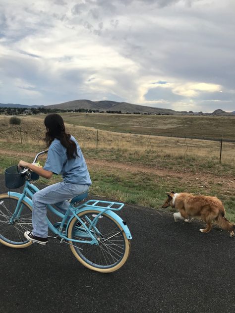 Girl riding blue bike with basket next to collie in mountains City Bike Aesthetic, Riding Bicycle Aesthetic, Vintage Bike Aesthetic, Collie Aesthetic, Woman Riding Bike, Riding Bike Aesthetic, Aesthetic Bikes, Bikes Aesthetic, Bike Riding Aesthetic