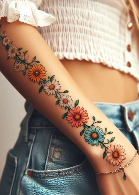 Daisy Tattoo On Leg, Flower Tattoos For Women Thigh, Gerbera Daisies Tattoo, Chain Of Flowers Tattoo, Daisy And Sun Tattoo, Colorful Daisy Tattoo, African Daisy Tattoo, Crazy Daisy Tattoo, Daisy Vine Tattoo