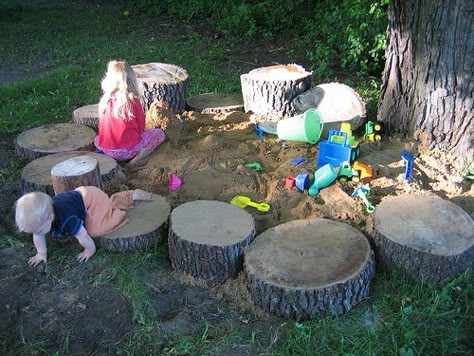 Natural sandbox surrounded by log stumps. . perfect for sitting on! Natural Playscapes, Backyard Sandbox, Backyard Play Spaces, Toddler Garden, Diy Sandbox, Cat Playground Outdoor, Play Area Backyard, Outdoor Play Spaces, Outdoor Play Areas