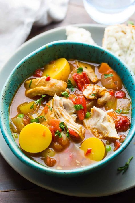 Slow Cooker Spanish Chicken Stew in a blue bowl Chicken Stew Slow Cooker, Spanish Chicken Stew, Chicken Stews, Stew Slow Cooker, Slow Cooker Chicken Stew, Chicken Stew Recipe, Saffron Recipes, Spanish Chicken, Stew Chicken Recipe