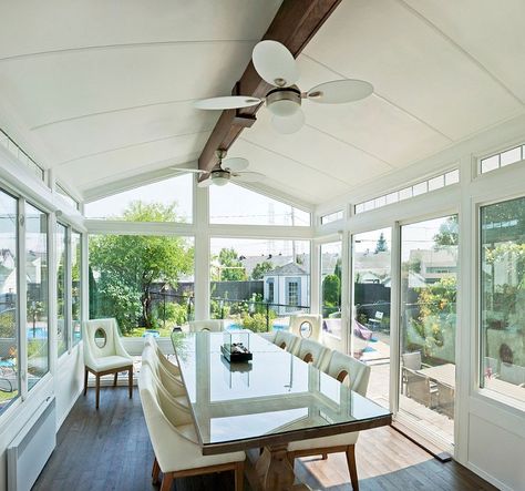 White cathedral style sunroom with a smart dining space [Design: LivingSpace Sunrooms] - Decoist White Cathedral, Four Season Sunroom, All Season Room, 3 Season Room, 4 Season Room, Four Seasons Room, Sunroom Addition, Three Season Room, Patio Enclosures