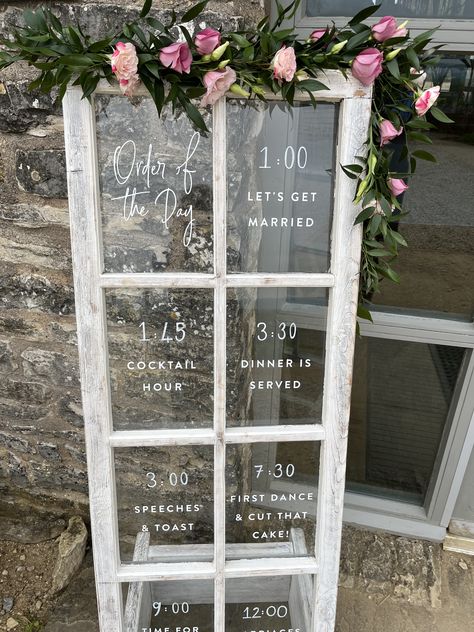 A simple garland of flowers decorated this rustic door sign Farm Wedding Entrance, French Doors Wedding, Old Window Wedding Decor, Door Wedding Entrance, Simple Garland, Garland Of Flowers, Order Of The Day Wedding, Farm Door, Window Signage