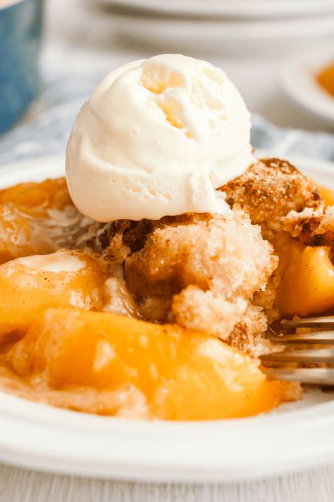 Whether you use canned, fresh, or frozen peaches, this juicy peach cobbler is sure to delight. It's a classic dessert made simple with the magic of Bisquick! Bisquick Cobbler, Paula Deen Peach Cobbler Recipe, Bisquick Peach Cobbler, Cobbler With Bisquick, Peach Cobbler With Bisquick, Fresh Peach Cobbler, Easy Peach Cobbler, Southern Peach Cobbler, Easy Peach Cobbler Recipe