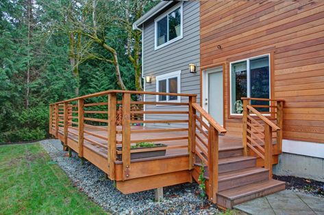 Raised Wooded Walkout Deck construction With Railing, Stairs, and Steps Deck Cost, Redwood Decking, Deck Remodel, Deck Repair, House Trim, Wooden Deck, Patio Enclosures, Deck Construction, Decking Material