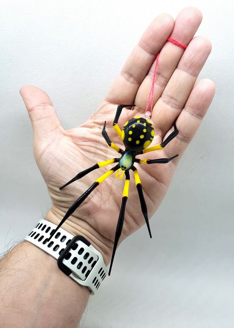 Beautiful model of a handmade Hanging Yellow Spider made of blown glass using the lampwork technique (also called glass blowing). Please pay attention at colors of the figurine- we used no paints or decal, only color glass. All shop: https://www.etsy.com/shop/OVGlassArtStudio Follow us: https://www.facebook.com/Aenpu/ https://www.instagram.com/ovglassart/ David Bowie Glass Spider, Fused Glass Spider, Yellow Spider, Glass Animals Figures, Glass Spider, Insect Wire Sculpture, Barista Fashion, Handmade Hanging, Spider Art