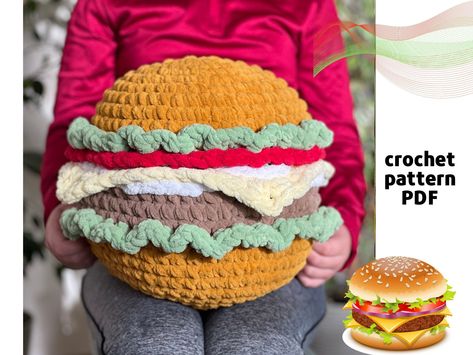 Unlock endless creativity with our crochet patterns! Click the link above to explore and start your next project today. #CrochetPatterns #DIYCrochet 👮‍♀️ Giant Strawberry Crochet Pattern, Movie Inspired Crochet, Burger Crochet, Crochet Burger, Giant Amigurumi, Crochet Popsicle, Burger Plush, Giant Burger, Crochet Lego