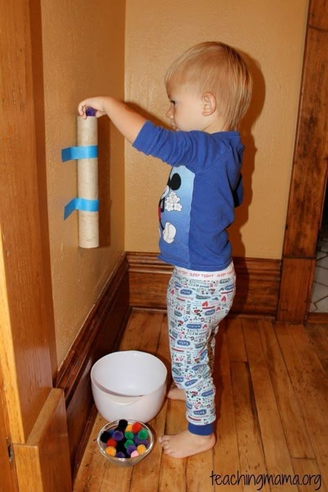 Tape a paper towel roll to the wall to keep toddlers busy. | 33 Activities Under $10 That Will Keep Your Kids Busy All Summer Keep Toddlers Busy, Winter Project, Games For Toddlers, Cotton Balls, Toddler Play, Busy Toddler, Toddler Fun, Toilet Paper Roll, Craft Activities For Kids