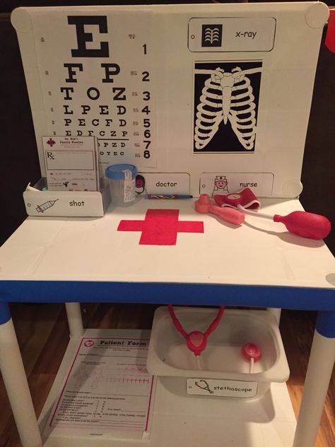 DIY Toddler Doctors Office Play Area Diy Doctor Play Area, Diy Role Play Area, Play Area In Classroom, Pretend Doctor Office, Diy Doctor Play Set, Doctor Pretend Play Set Up, Diy Doctors Office Pretend Play, Diy Doctor Office Pretend Play, Doctor Play Area For Kids