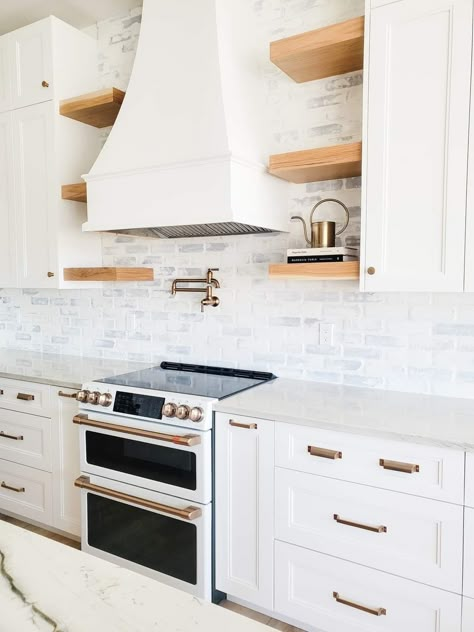 White Brick Kitchen, Brick Kitchen Wall, Bonnie Ryan, White Brick Backsplash, Kitchen Hood Ideas, Brown Countertop, Black Stove, White Bricks, Brick Backsplash Kitchen