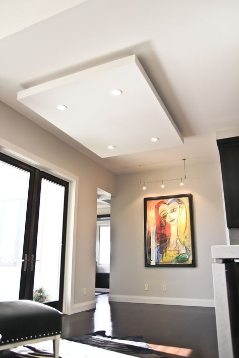 "Floating" ceiling adds dimension to this contemporary space and allows for pot light application. Floating Ceiling Ideas, False Celling Design With Profile Light, Plain Ceiling With Profile Light, Coffered Ceiling Led Lighting, Gypsum Ceiling With Cove Light, False Ceiling For Hall With Profile Lights, Ceiling Paint Ideas, Diy Coffered Ceiling, Dining Room Lighting Over Table