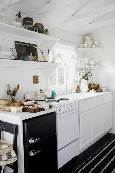 The tiny kitchen is inspired by European designs and includes a miniature stove and microwave. Small House Pictures, Shed Inspiration, Converted Shed, Tiny Kitchen Design, Best Tiny House, Tiny Cottage, Tiny House Kitchen, Backyard Shed, Classic Kitchen