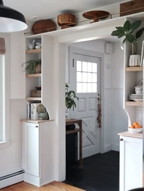 Galley Kitchen End Wall, Kitchen Cabinet Next To Doorway, Built In Around Doorway, Kitchen With Multiple Doorways, Shelf Over Doorway, Front Door Into Kitchen, Kitchen Entry Design, Cabinet Wall Kitchen, Doorway Shelf