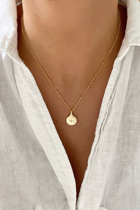 Unveil your everyday allure with our Gold Filled Chain, the ultimate modern accessory. Sleek, chic, and designed for the contemporary woman, it's your versatile go-to for every outfit, every mood. Make a statement, elevate your style – it's more than jewelry; it's an expression of your modern spirit. 💫✨ #EverydayChic #GoldFilledJewelry #ContemporaryStyle Coin Necklace Gold, Necklace Gold Pendant, Disk Necklace, Gold Necklace Simple, Gold Coin Necklace, Tiny Star, Medallion Necklace, Disc Necklace, Necklace Dainty