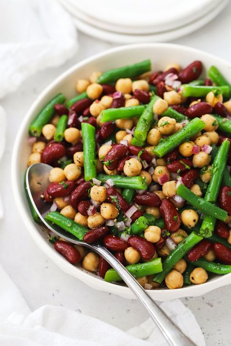 This healthy 3-bean salad recipe is a light, refreshing side dish for summer BBQs, picnics & potlucks. We use a classic bean salad combination of green beans, red kidney beans, and chickpeas (garbanzo beans), finished with a light vinaigrette. This marinated bean salad ends up so light and fresh. It's also gluten-free, dairy-free, vegan, and naturally sweetened--the perfect summer side dish! Marinated Bean Salad, Cooking Frozen Green Beans, Bean Salad Recipes Easy, Bean Salad Dressing, 3 Bean Salad, Street Corn Salad, Mexican Corn Salad, Broccoli Salad Bacon, Red Kidney Beans