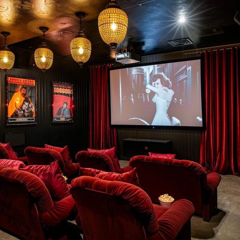 Vintage glamour home cinema room with red velvet seats, vintage film posters, and ornate lantern-style lighting fixtures, creating an intimate viewing experience. Home Cinema Room Ideas, Vintage Film Posters, Theatre Room Ideas, Theater Room Decor, Film Screening, Glamour Home, Theatre Interior, Home Cinema Room, Dream Life House