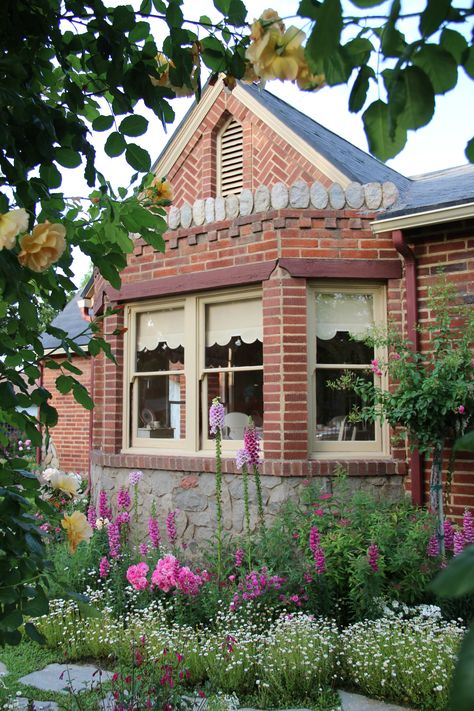 lovely bay window with rock parapet Cottage With Bay Window, Bay Window Flower Beds, Landscaping Around Bay Window, Bay Window Landscape Ideas, Bay Window Landscaping, Bay Window Garden, Rose Arch, England Town, Entry Gate