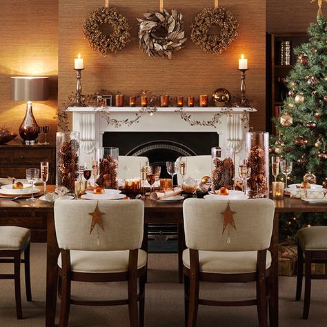 Christmas dining room with copper accessories | Dining room decorating | Ideal Home | Housetohome.co.uk Dinner Table Design, Christmas Dining Room Decor, Wooden Tea Light Holder, Frosted Christmas Tree, Dining Room Sideboard, Christmas Dining Room, Christmas Tabletop Decor, Christmas Dinner Table, Christmas Table Centerpieces