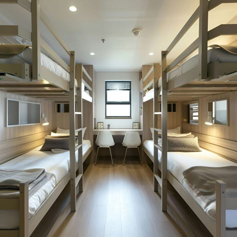 This modern dormitory room features a Scandinavian design with four bunk beds, white bedding, and individual reading lamps. The room's light wood furnishings and neutral tones create a warm, inviting atmosphere. A window at the back provides natural light to a study area with a shared desk and two contemporary white chairs, perfect for focused study sessions. Ideal for those seeking a stylish, efficient, and cozy dormitory space. Orphanage Home Design, Dormitory Design, Aesthetic Hostel Room, Dormitory Design Architecture, Dormitory Layout, Dormitory Concept, Student Dormitory Room, Dormitory Room For 4, Four Bunk Beds