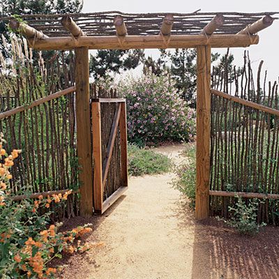 Native fence    A decomposed granite path passes through a fence and gate made from Ocotillo (Fouquieria splendens), a Southwest native.    The winding walkway invites exploration of more of this casual low-water landscape. Low Water Landscaping, Deer Resistant Garden, Garden Gate Design, Decomposed Granite, Garden Fencing, Gorgeous Gardens, Garden Structures, Garden Fence, Rustic Gardens