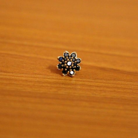 A black stone nose pin looks very pretty on any woman. Pick from a wide variety of nose pin collections from Kalyan. Nose Pin Designs, Latest Diamond Jewellery, Diamond Jewellery Designs, Kalyan Jewellers, Stone Jewellery Designs, Designer Diamond Jewellery, Stone Jewellery, Nose Pin, Trendy Designs