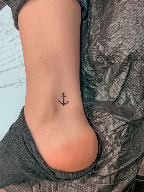 50 Best Small Travel Tattoos Ideas That Will Inspire Inner Wanderers Nautical Small Tattoos, Minimal Anchor Tattoo, Anchor Tattoo Ideas For Women, Small Anchor Tattoos For Women Simple, Mini Anchor Tattoo, Anchor Tatoos Woman, Us Navy Tattoos For Women, Tattoo Anchor Women, Dainty Anchor Tattoo