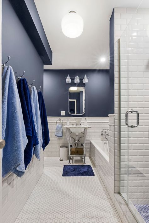 Our mantra: find a color or design that matches your style and personality. 💙What color or design best matches you? Comment below with an emoji!   A room once bathed in beige gets new blue energy. This Sweeten couple transformed their bathroom by adding in blue tile, a coat of dusky blue paint, an open-console vanity, and much more. Blue Penny Tile, Blue And White Bathroom, Art Deco Bathroom, Penny Tile, Deco Bathroom, Beige Bathroom, Blue Beauty, Style Deco, Living Room Remodel