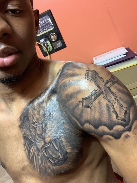 Cross On Shoulder Tattoo For Men, Christian Chest Tattoos For Men, Cross On Shoulder Tattoo, Shoulder Tattoo Designs Men, Pec Tattoo Men Ideas, Cross Tattoos For Men Shoulder, Chest To Arm Tattoo Men, Shoulder Cross Tattoo Men, Lion Shoulder Tattoo Men