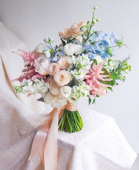 A pastel spring bouquet with peachy, pink, blue and white blooms and greenery plus long ribbons Centerpieces Ideas, Pastel Wedding Flowers, Pastel Bouquet, Summer Wedding Bouquets, Blue Wedding Bouquet, Wedding Bouquets Pink, Peony Wedding, Spring Wedding Flowers, Wedding Flowers Summer