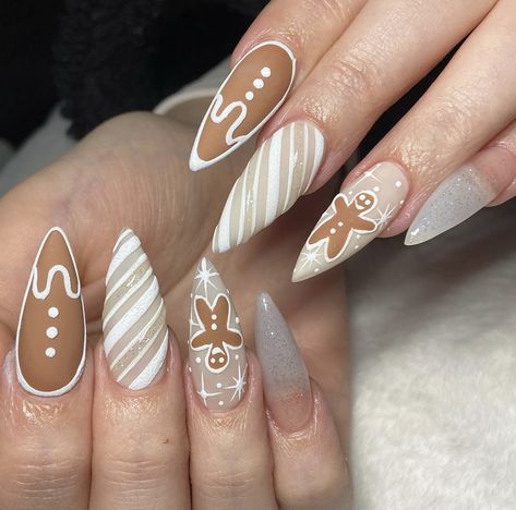 long, stiletto shaped festive, gingerbread themed nails with silver glitter accents & gingerbread men. Gingerbread Nails Acrylic, Gel Art Nails, Gingerbread Nails, Nails Acrylic Long, Nail Inspo Ideas, Nail Work, Long Stiletto, Gel Art, Nails Cute