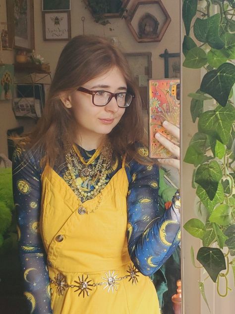 if it wasn't obvious, I love this blue shirt lol. And I've grown to love wearing yellow! The necklaces are all made by me, the shirt is (I believe) thrifted Forever 21, the dress is thrifted American Eagle, and the sun belt is from depop (ask about the specific supplier). Tags: celestial, yellow, sunflower yellow, blue, midnight blue, summer dress, DIY jewelry, sun, moon, thrifted, alternative, alternative style, women's style, eclectic style, eccentric style, stars, clouds, gold jewelry Sun And Moon Aesthetic Outfit, Sun And Moon Outfit Ideas, Blue And Yellow Aesthetic Outfit, Summer Dress Diy, Blue And Yellow Outfit, Celestial Outfit, Sun Outfits, Moth Oc, Sun Belt