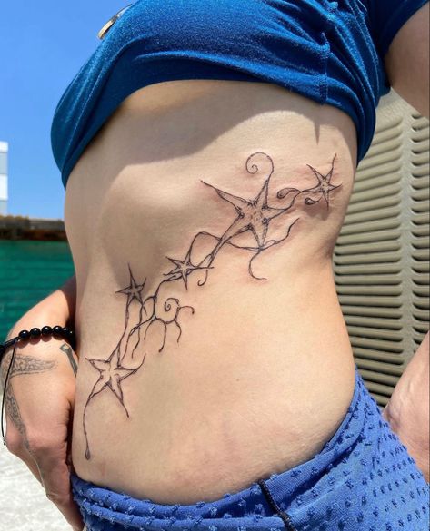 Star Tattoos On Ribcage, Star Tattoo Ribcage, Stars Rib Tattoo, Grunge Fairycore Tattoo, Cybersigilism Rib Tattoo, Whimsical Tattoo, Funky Tattoos, Stomach Tattoos, Knee Tattoo