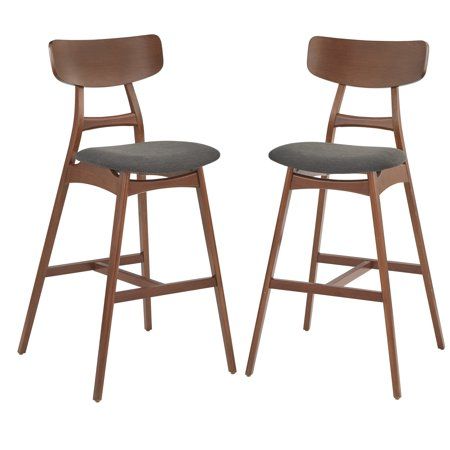 Give your space a modern midcentury appearance with these striking Ron Stools. Fashioned with solid beech wood in Walnut finish Ron Stools feature cushioned seats, a footrest and backrest. 30-inch seat height makes the stool appropriate for most bar-height pub table.The stool is generously upholstered in grey color fabric with supportive cushioning. Crafted of solid beech wood in a Walnut finish. The angled leg and the curved backrest give it a very elegant appeal. Come in a set of 2. Assembly r Modern Wood Cabinets, Gray Counter, Grey Bar Stools, Bar Stool Seats, Indoor Bar, Counter Bar, Bar Height Stools, Black Bar Stools, Wood Bar Stools