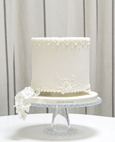 An ivory celebration cake with delicate hand piped details White Fondant Cake, Double Barrel Cake, Unusual Wedding Cakes, Edible Flowers Cake, Fondant Cake Designs, Simple Elegant Wedding, Dream Wedding Cake, Cake Shapes, Cupcake Tower