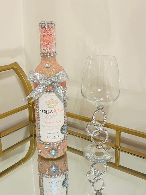 This diamond decor bottle will instantly add a touch of elegance to your room or entryway. Beautiful hand decorated bottle with sparkling extra fine iridescent peach glitter. I personally blended this color using 3 different colors of glitter and it looks amazing! Sparkling iridescent diamond gems throughout. Stunning crushed crystal and gemstone detail on the neck. Finished with a silver glitter bow. There are 2 finish options: - Diamond gemstones/crushed diamond neck and border around the labe Decorated Wine Bottles, Sparkly Alcohol Bottles, Sparkle Alcohol Bottle, Glitter Vodka Bottle, Pink Glitter Bottle, Badazzel Liquor Bottles, Bedazzled Liquor Bottles, Glitter Wine Bottles, Alcohol Bottle Crafts