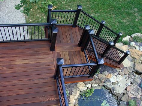 Black Wood Porch, Black And Wood Deck, Brown And Black Deck Ideas, Black Stained Deck, Brown And Black Deck, Dark Brown Deck, Dark Brown And Black Deck, Dark Stained Deck With Black Railings, Walnut Stained Deck