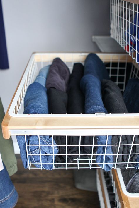 Storing jeans in a wire basket in the closet. I decided to overhaul my drawers with the Marie Kondo fold. Here's the step-by-step process to get your sweaters and jeans folded perfectly! #mariekondo #tidyingup #konmari #folding #organization #organized #organizedcloset How To Store Jeans In Drawer, Marie Kondo Closet Organization, Store Jeans In Closet, Jean Organization Drawers, How To Store Jeans, Organize Jeans In Closet, Best Way To Store Jeans, Jeans In Closet, Jean Storage