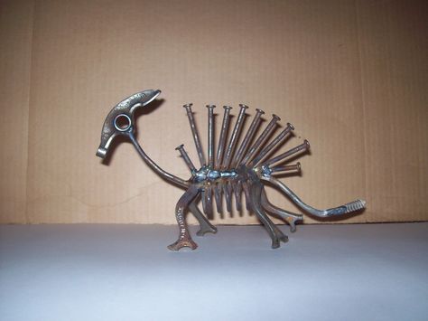 Darwin-isum! Made by J.R.Hamm Created from recycled scrap metal #tiny #new #creatures Motorcycle Crafts, Skeleton Statue, Soldering Station, Dinosaur Skeleton, Welding Art Projects, Arte Robot, Metal Yard Art, Metal Welding, Steel Art