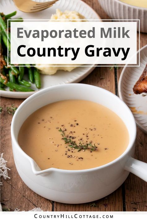 Evaporated milk gravy is rich, smooth, and ultra-creamy. The recipe is easy to make with a handful of ingredients and tastes delicious with sausage and biscuits, roasted turkey, steak, fried chicken, mashed potatoes, and more! Evaporated milk may seem a strange addition to gravy. But if you enjoy Southern cuisine, you know biscuits and sausage gravy. This delicious dish uses evaporated milk to create a rich and thick gravy with a velvety mouthfeel and creamy texture. | CountryHillCottage.com Recipes Using Evaporated Milk, Milk Gravy Recipe, Sausage And Biscuits, Fried Chicken Mashed Potatoes, Savory Hand Pies Recipes, Brown Gravy Recipe Easy, Country Gravy Recipe, Biscuits And Sausage Gravy, Biscuits And Sausage