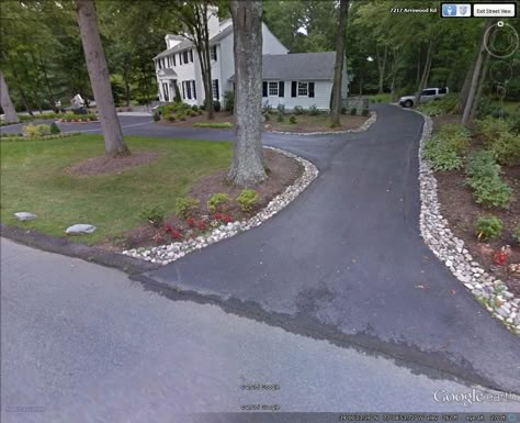 River rock driveway border in Bethesda, MD recently completed by Denchfield Landscaping.  I would recommend a slightly smaller sized variety of river rock.  I can also look into a darker stone (however, the darker stone may be pricey). Will keep you posted. Driveway Lined With Rocks, River Rock Driveway Edging, Mulch Driveway Border, Driveway Stone Edging, Driveway Entrance Landscaping Rocks, Driveway Rock Border, Rock Lined Driveway, Rock Driveway Edging Ideas, Driveway Border Plants