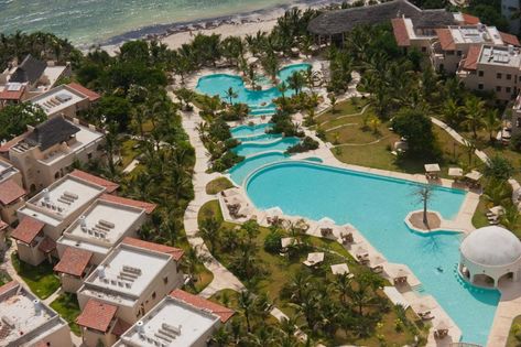 Citizen Femme | Cascading pools? Yes please! Swahili Beach Resort in Diani African Vacation, Diani Beach, Pool Activities, Luxury Safari, Wooden Gates, Mombasa, Rock Pools, Beach Hotel, Beach Bars