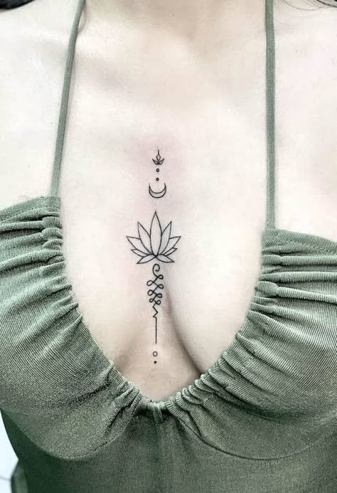 63 Soulful Lotus Tattoos with Meaning - Our Mindful Life Small Meaningful Tattoos For Women Chest, Lotus Flower Tattoo Between Breast, Lotus Flower Tattoo Under Breast, Lotus Chest Tattoo, Lotus Flower Spine Tattoo, Cleavage Tattoos For Women, Lotus Tattoo Ideas For Women, Tattoo In Between Chest Woman, Middle Of Chest Tattoo Female