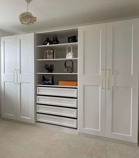 Get inspired with these IKEA Pax ideas and hacks. Turn a plain IKEA Pax closet system into the wardrobe of your dreams with these inspirational examples... #ikeapaxideas #ikeapaxhacks #ikeapaxhack #ikeapaxhackcloset #ikeapaxclosetideas #ikeapaxclosethack #ikeapaxhackbuiltins #ikeapaxclosetwalkin #ikeapaxclosetwithdoors #ikeapaxwardrobeideas Ikea Pax In Office, Closet Designs Ikea Pax Wardrobe, 12 Foot Closet Doors, Ikea Closet With Doors, Ikea Pax Office Storage, Pax Wardrobe Room Divider, Ikea Pax Wardrobe Ideas With Tv, Ikea Pax Wardrobe Layout, Pax Wardrobe Ideas Master Bedrooms