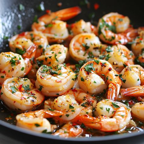 🦐🔥 Get a taste of the sea with our sizzling Sizzling Gambas! A garlicky shrimp sensation! 🌶️🍤 #SeafoodLovers Sizzling Gambas (Garlic Shrimp) Ingredients: Shrimp, peeled and deveined (1 lb) Garlic, minced (5 cloves) Olive oil (2 tbsp) Paprika (1 tsp) Lemon juice (1 tbsp) Red chili flakes (1/2 tsp) Salt and pepper to taste Fresh parsley, chopped (2 tbsp) Instructions: Heat olive oil in a skillet. Add garlic and sauté until golden. Add shrimp, paprika, chili flakes, salt, and pepper. Cook un... Garlicky Shrimp, Red Chili Flakes, Garlic Shrimp, Chili Flakes, Trending Recipes, Fresh Parsley, Looks Yummy, Tasty Dishes, Food Inspiration