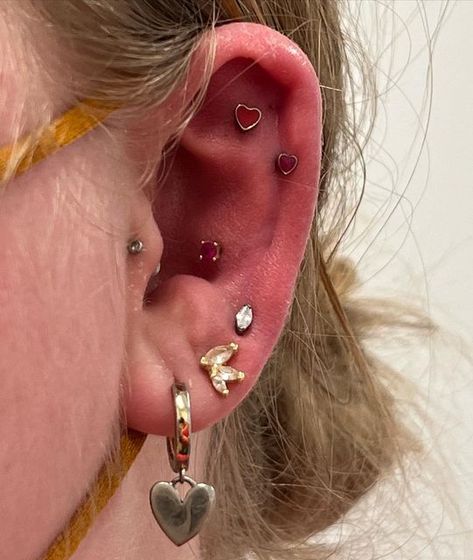 Jacqueline Riley on Instagram: "Valentine helix heart piercings @emma.lamb @studs #earscape #studs #studshtx @earscape_artist #helixpiercing #helox #conchpiercing #valentinepiercing" Helix Heart Piercing, Heart Flat Piercing, Colorguard Uniforms, Helix Piercing Stud, Flat Piercing, Heart Piercing, Accessory Inspo, Goofy Ahh, Conch Piercing