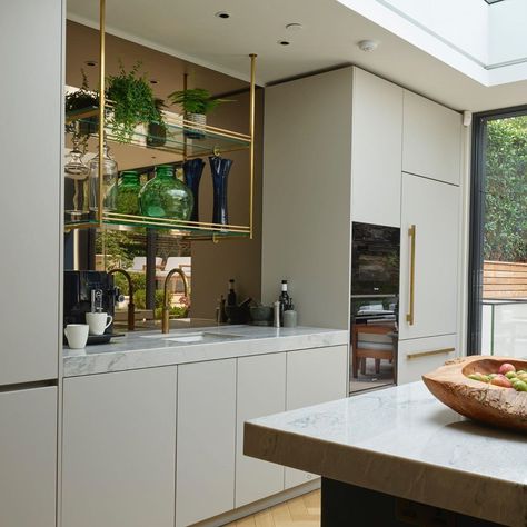 Roundhouse on Instagram: “Suspended brass shelves, brass handle details and a Bronze mirror splashback add a touch of luxury...and dare we say it...glamour...to this…” Mirror Splashback Kitchen, Bronze Mirror Splashback, Brass Shelving, Kitchen Centerpiece, Bronze Mirror, Mirror Design Wall, Kitchen Splashback, Kitchen Cabinet Doors, Round House