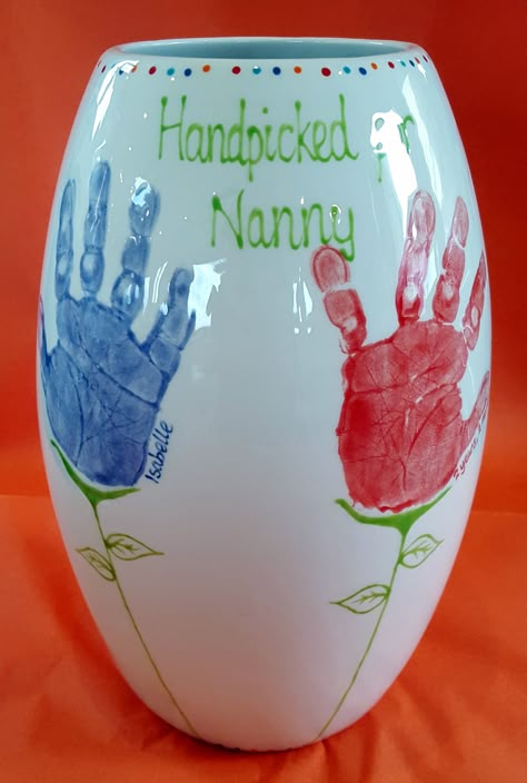 Tall Vase with Grandchildren's Handprints, turned into flowers.  Handpicked for Nanny. Baby Art Crafts, Kids Craft Gifts, Easter Crafts For Toddlers, Handprint Gifts, Halloween Crafts For Toddlers, Footprint Crafts, Baby Art Projects, Thanksgiving Crafts For Kids, Hand Prints