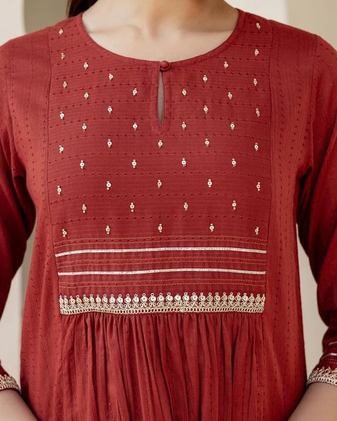 Eid Collection - New Arrivals! Beautiful crafted on a muted rust red, our Ayat Kurta is festive enough for a celebration and casual enough for a day in! The textured dobby yoke is delicately dotted with sequin and silver gota trims. Shop the Eid Collection in stores and online www.cottonsjaipur.com [ Cottons, Cotton Kurta, Eid Collection, Eid Mubarak, Celebration, Auspicious, Ethnic wear, Festive, Minimal, Traditional, Handmade Kurta] #cottons #cottonsjaipur #newarrivals #eid #eidmubara... Churidar Embroidery, Yoke Designs, Cotton Wardrobe, Idea Embroidery, Minimal Traditional, Embroidery Sleeves, Kurti Sleeves, Cotton Tops Designs, Kurti Sleeves Design