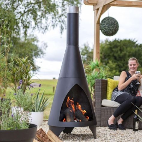 Truly contemporary in both design and finish, this stylish chiminea is a must-have for any garden space seeking a sense of modern charm. This chiminea has been crafted from high-quality steel and finished in a sleek midnight black, complete with a stainless-steel finial. Featuring a fluted triangular shape, this design also comes complete with three integral legs to ensure stability when in use. Perfect for those who love to entertain in their gardens, fill this chiminea with logs Metal Stair Spindles, Friends Chatting, Outdoor Wood Burner, Wood Burners, Stair Spindles, Copper Lantern, Wild Bird Feeders, Metal Stairs, Garden Furniture Covers